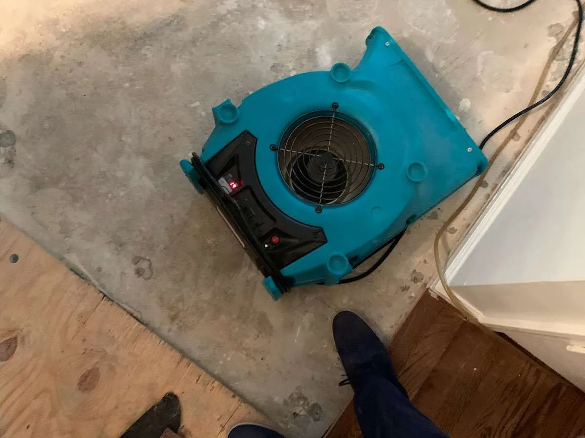 Air mover drying subfloor during Leak Detection & Repair in Crozet